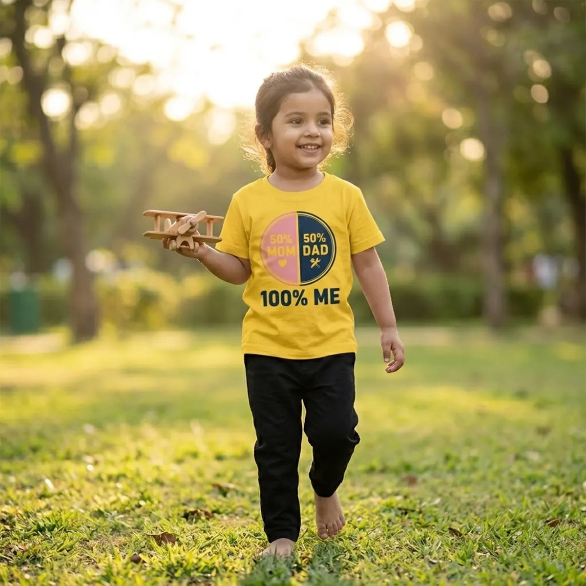 Kid wearing yellow 100 percent me slogan t-shirt
