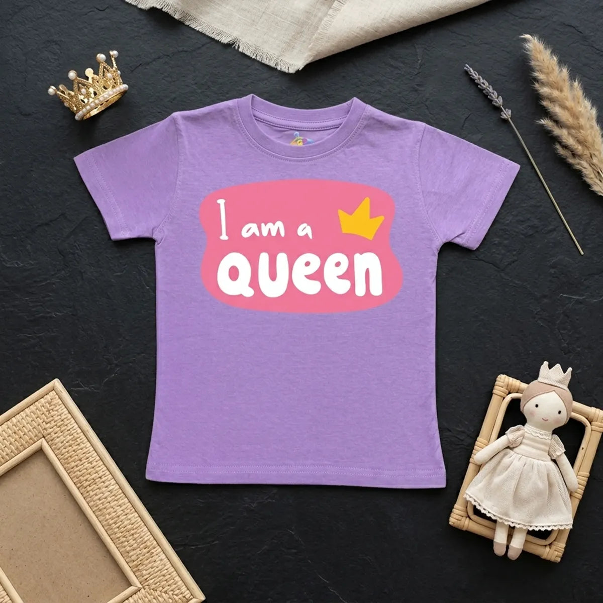 Lavender kids t-shirt with i am queen slogan print flatlay